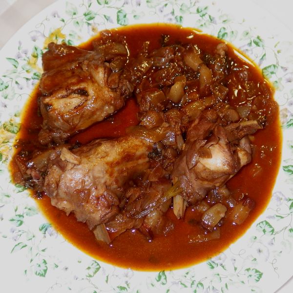 A picture of a plate of rabbit stew.